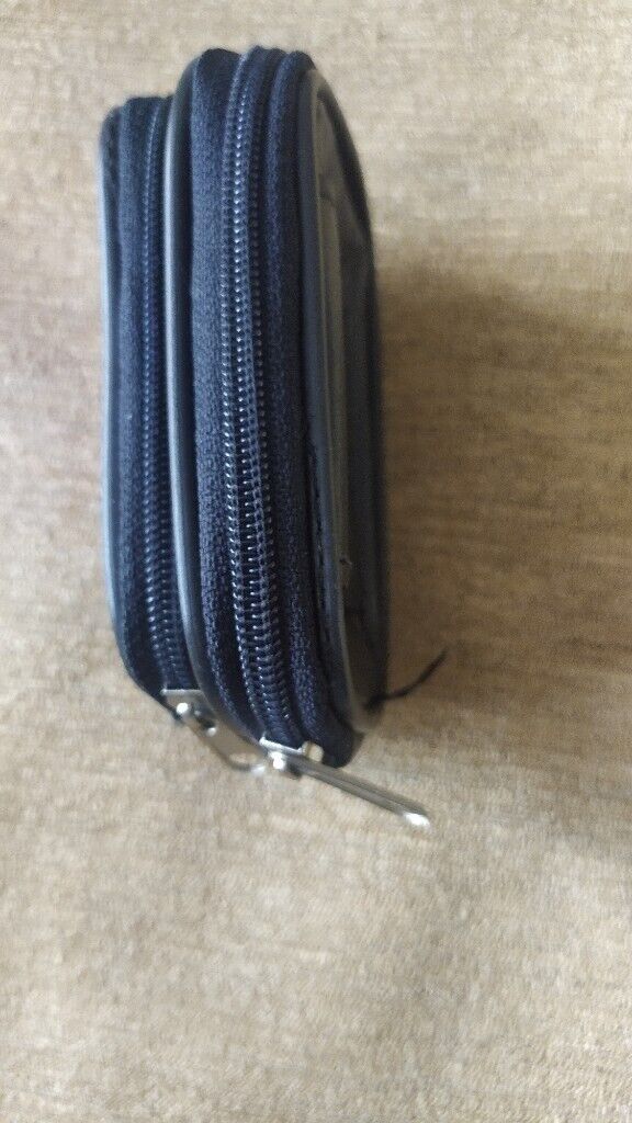 Small, black,good quality leather pouch. New.With loop for belt.