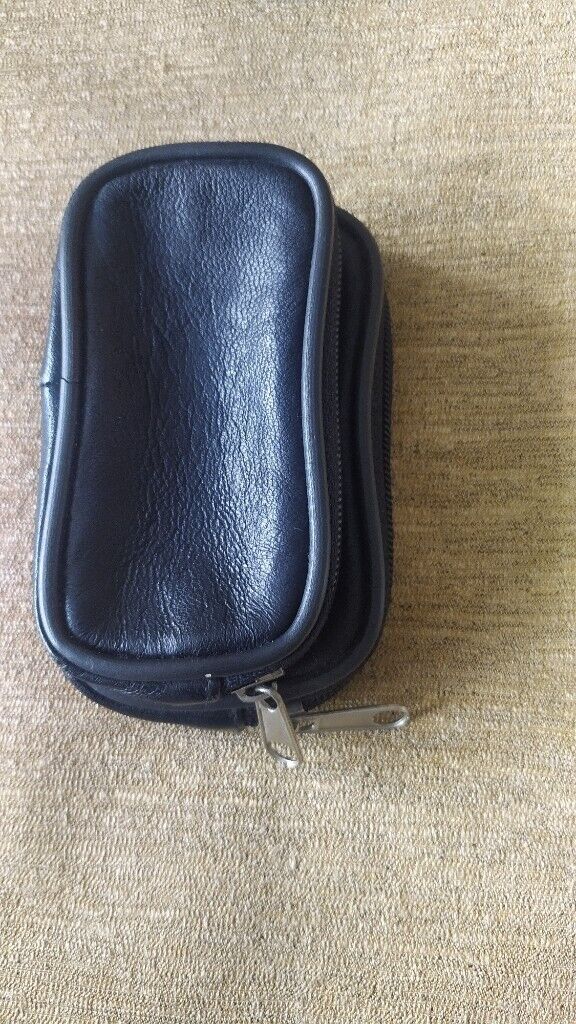 Small, black,good quality leather pouch. New.With loop for belt.