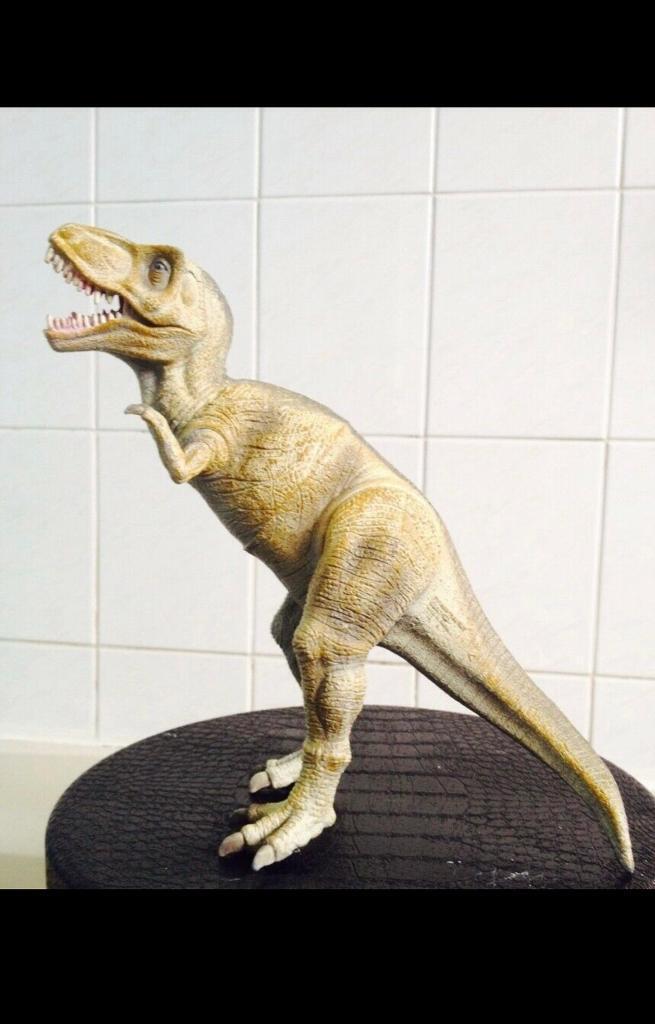 image for Cream running T-Rex figure