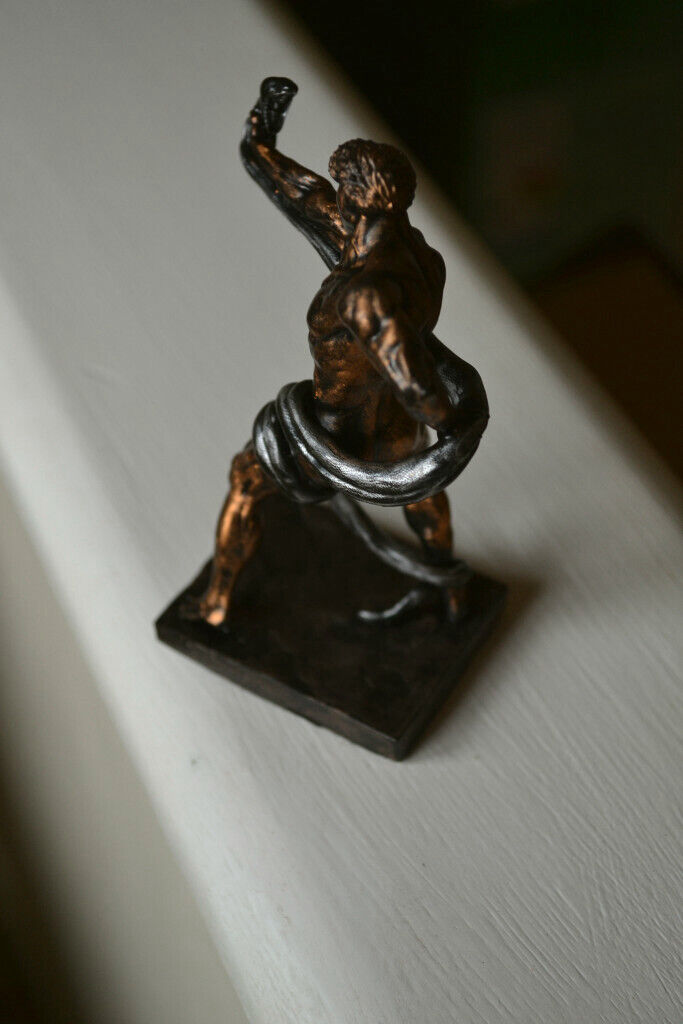 Naked athlete wrestling Python figurine