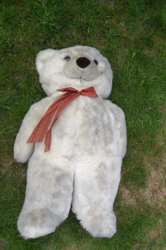 image for A very tall large white teddy bear.