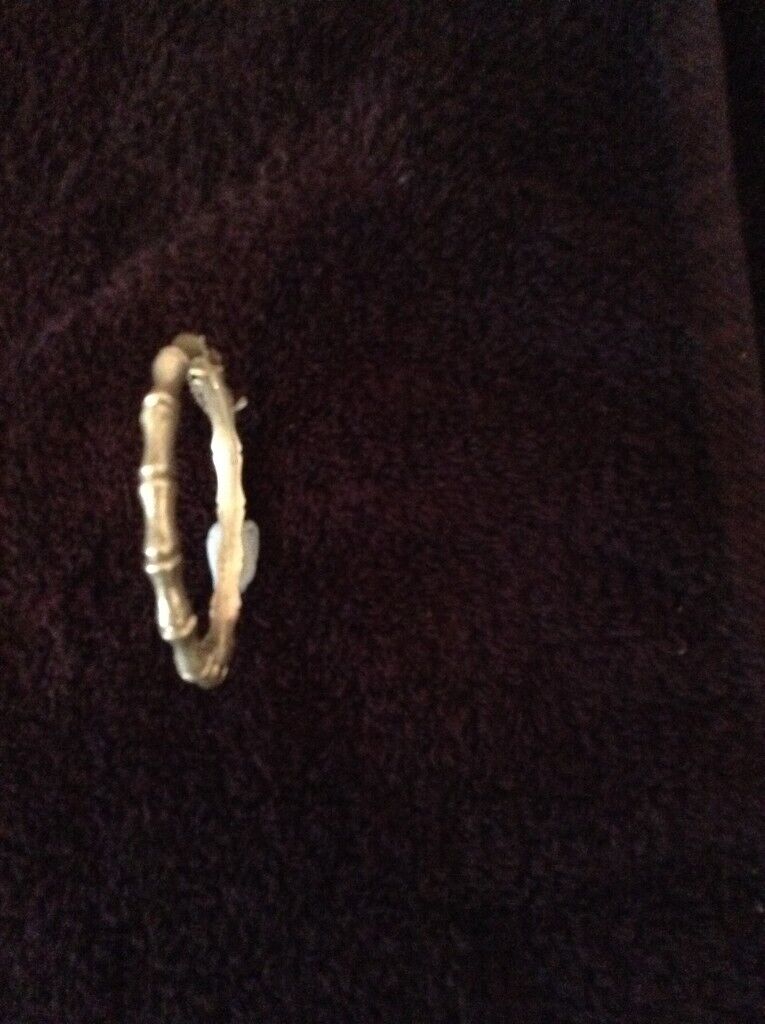 Bangle,silver ‘bamboo‘ style wrist bangle with safety chain, adult size.