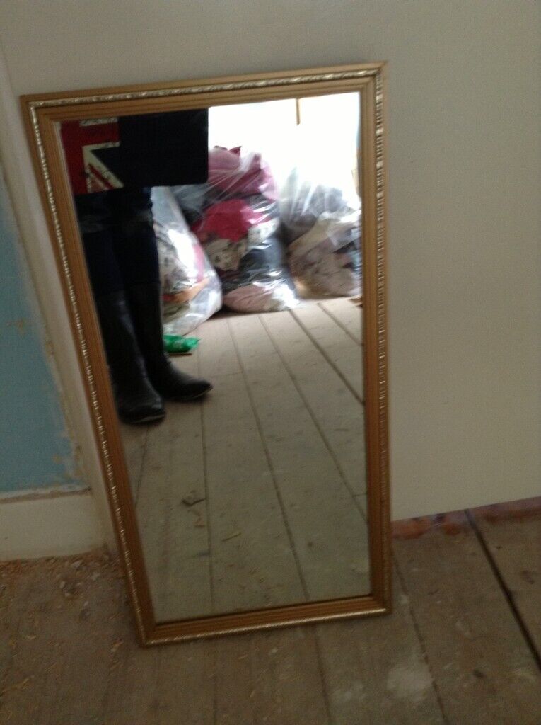 Mirror, gilt hanging wall mirror with ornate gold coloured surround