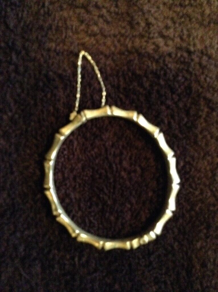 Bangle,silver ‘bamboo‘ style wrist bangle with safety chain, adult size.