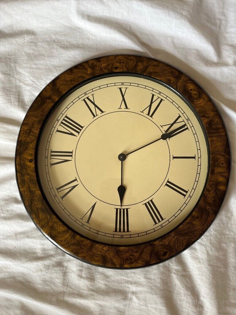 image for Wall clock. Walnut effect. Plastic. battery operated. 39cm