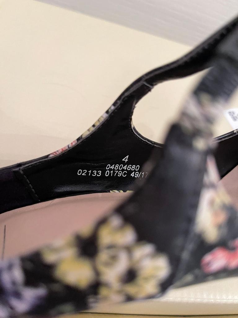 New, never worn. Lovely flower pattern high heels. Size 4