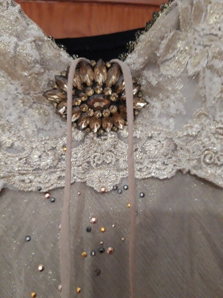 Ladies party/ occasion top. black back, gold front.  Size 10. as new