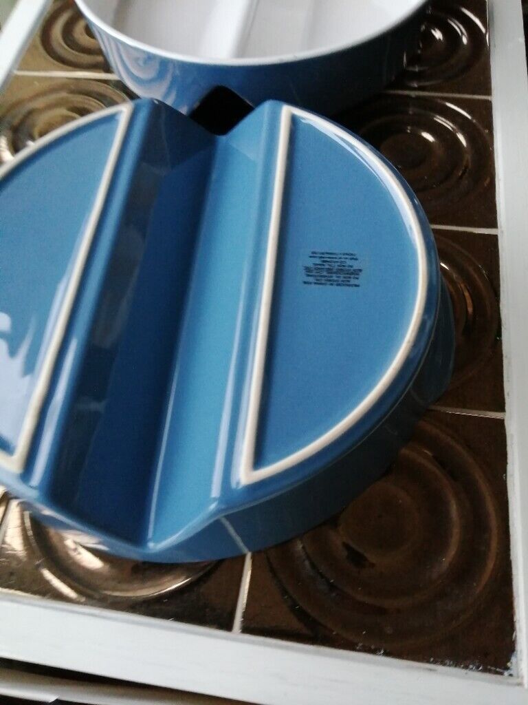 Two matching round oven dishes 