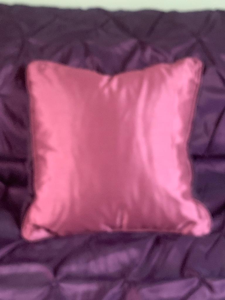 Cushion with jewelled brooch