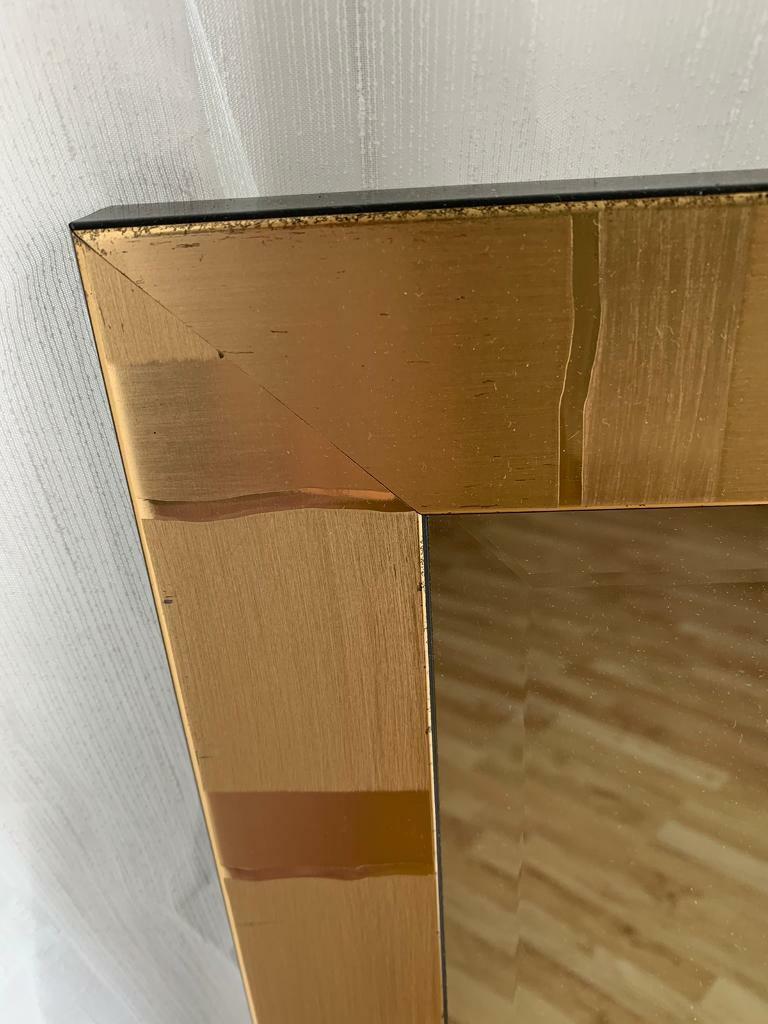 Full length antique gold coloured mirror