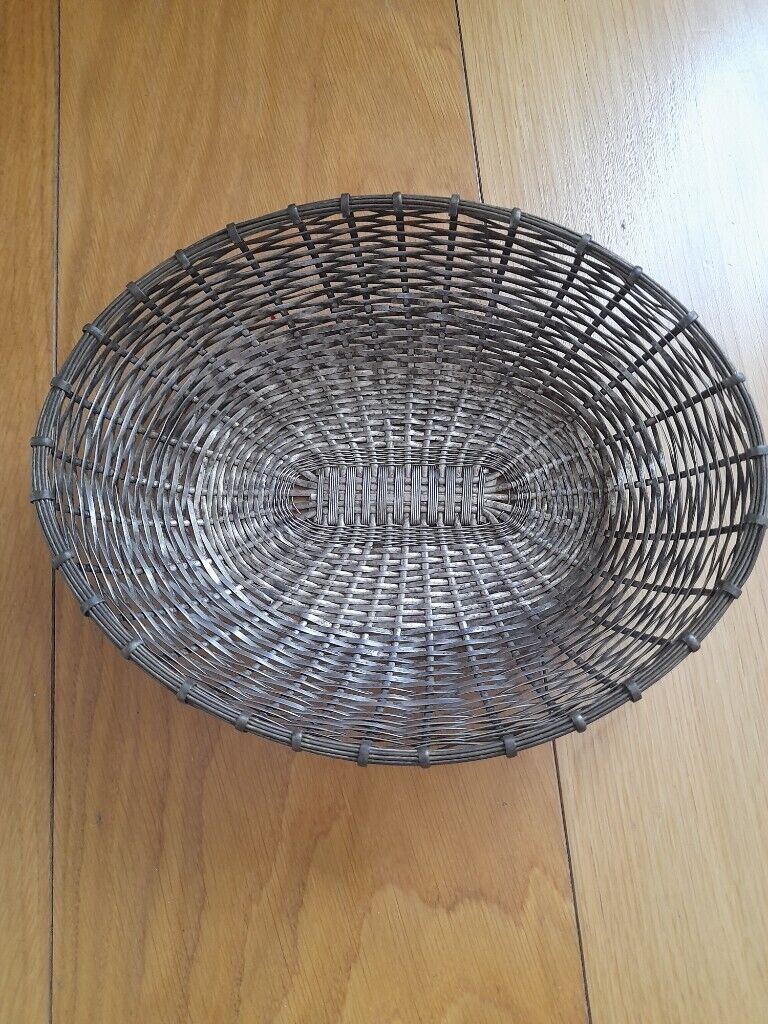 Vintage, silver metal woven bread or fruit basket. 
