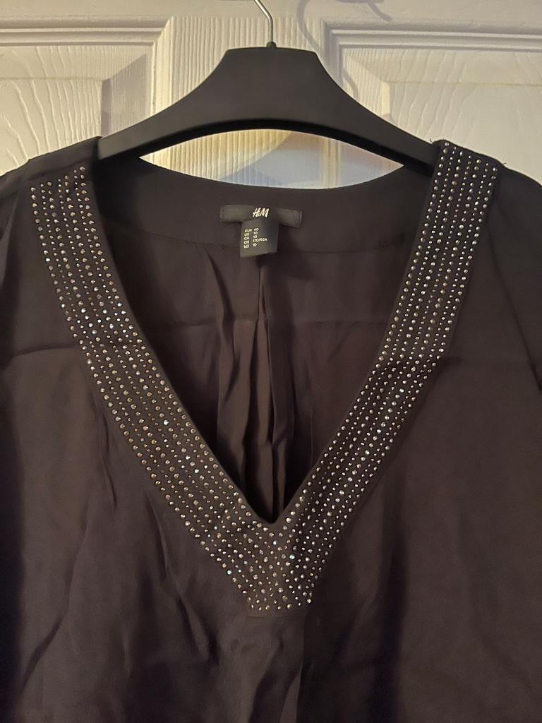 Black top with Diamonty detail around the neck size 12 from H&M 