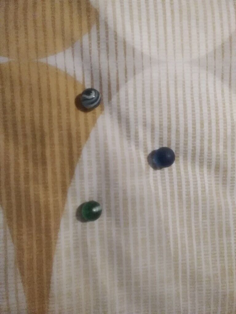 12 very collectible marbles and pouch few rare ones