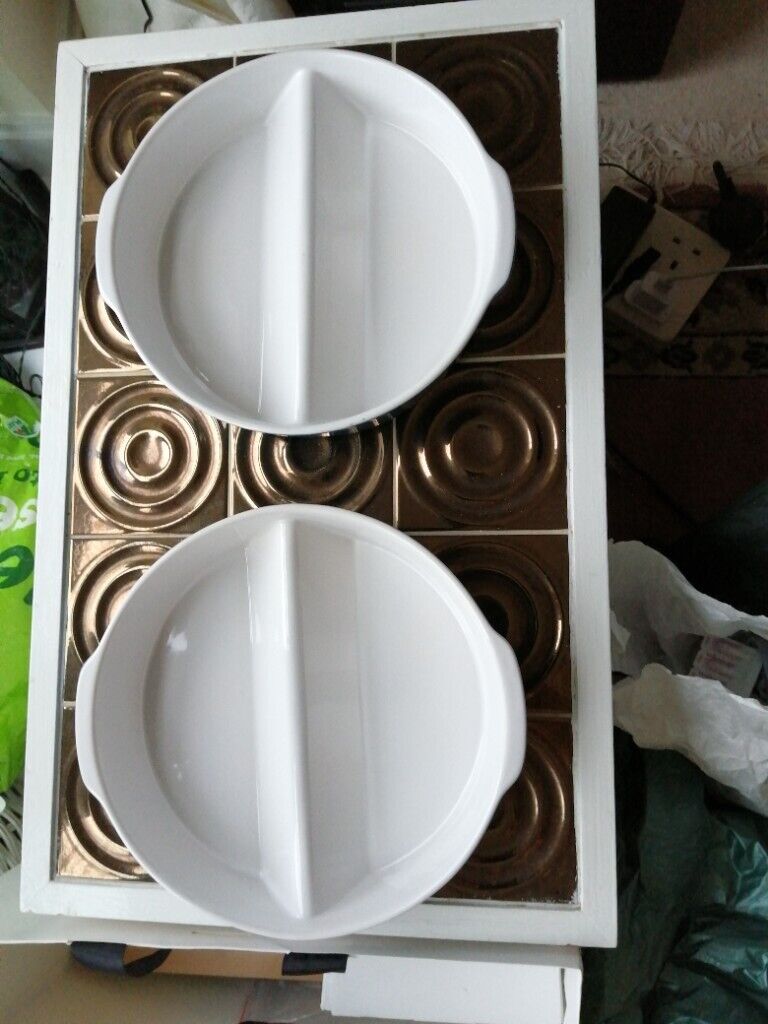 Two matching round oven dishes 
