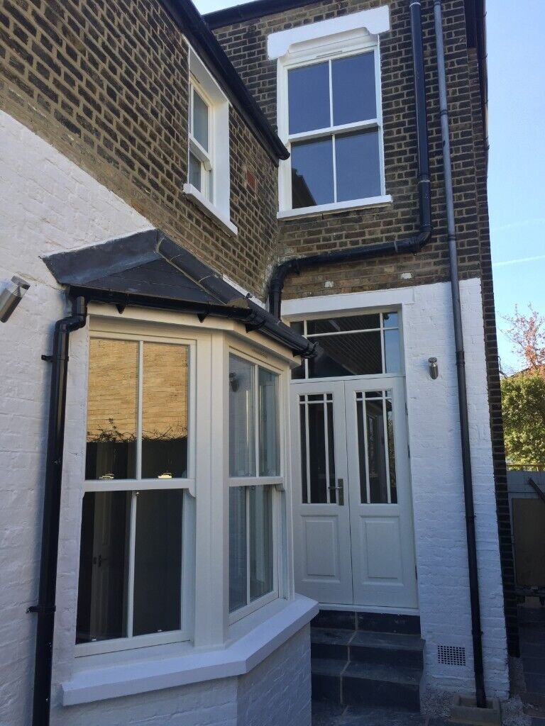 Traditional wooden sash window with key