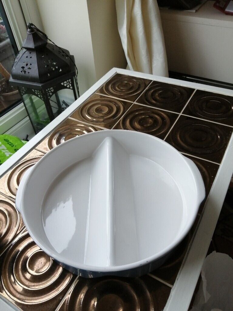 Two matching round oven dishes 