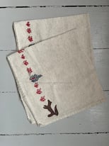 Pair of West Elm napkins with cute embroidery