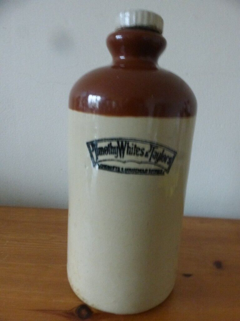 image for Antique Timothy Whites & Taylors stone water bottle. 10 inches tall