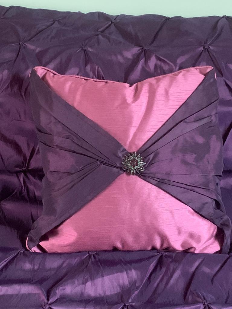 Cushion with jewelled brooch