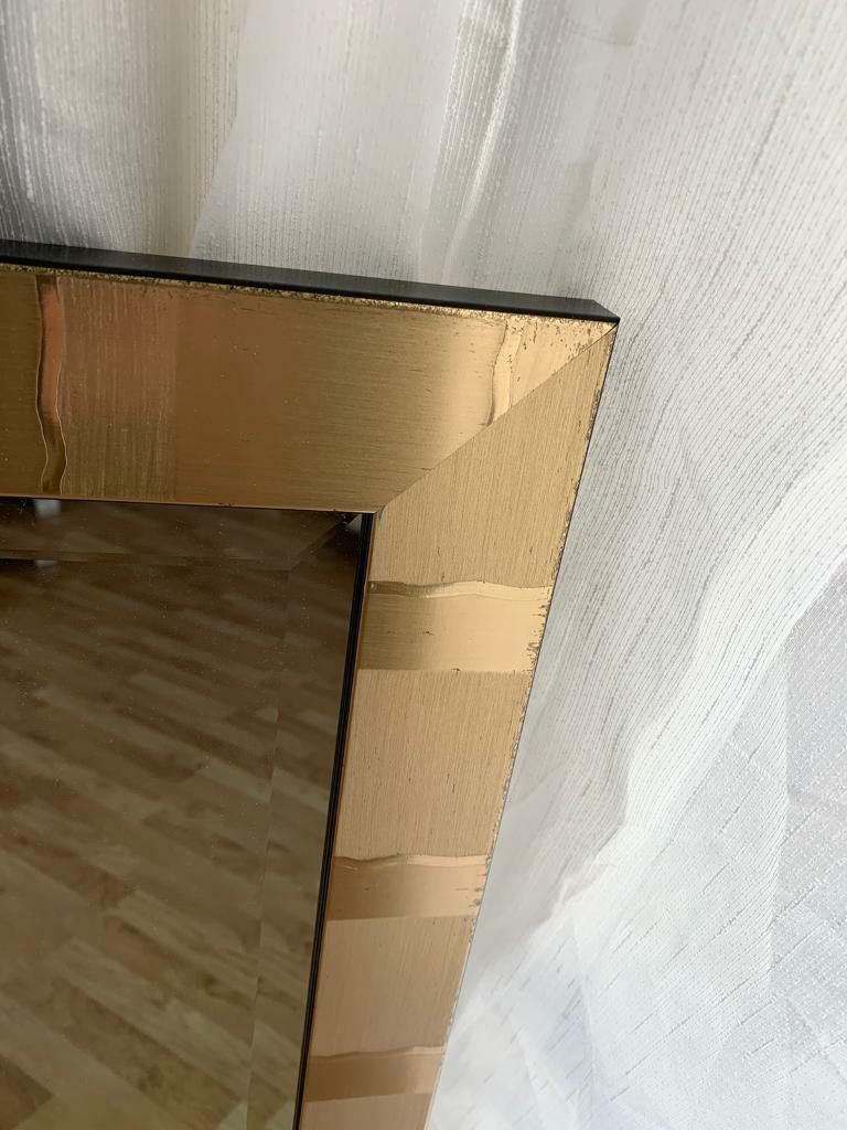 Full length antique gold coloured mirror