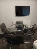 Ikea glass round dining table and 4 Tobias chairs