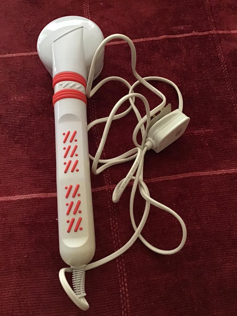 HAND HELD ELECTRIC VIBRATION AND/OR HEAT RELAXATION MASSAGER