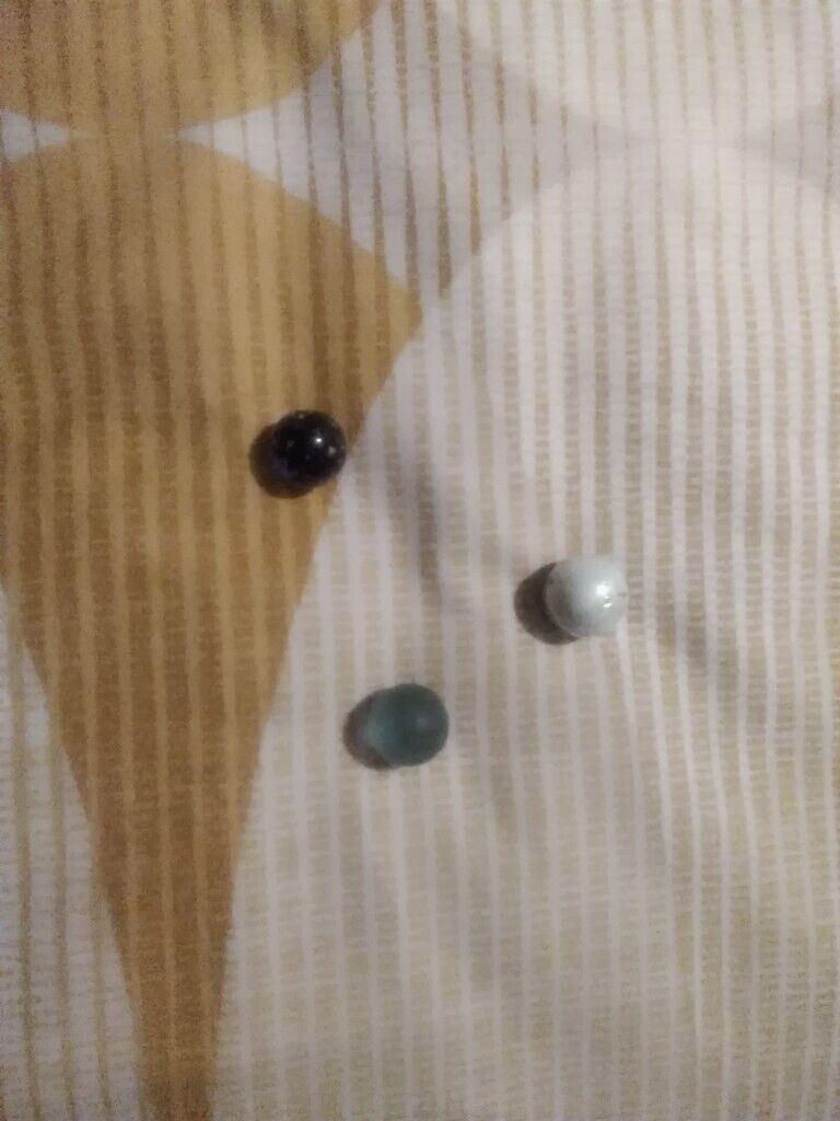 12 very collectible marbles and pouch few rare ones