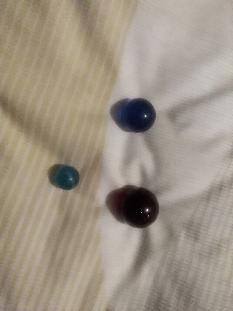 12 very collectible marbles and pouch few rare ones