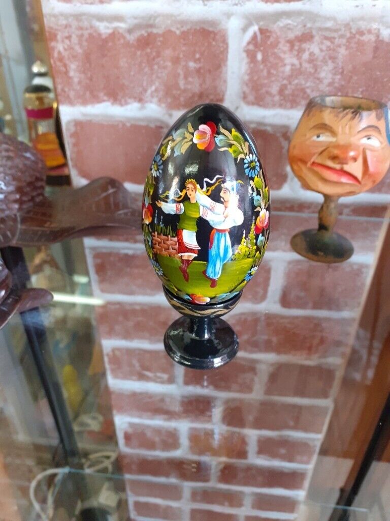 Vintage hand painted wooden egg with stand. Lacquered.