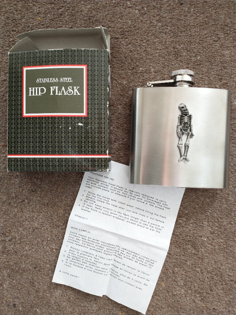 image for HIP-FLASK. BRUSHED STAINLESS STEEL. SKELETON FIGURE ON FRONT. NEW.