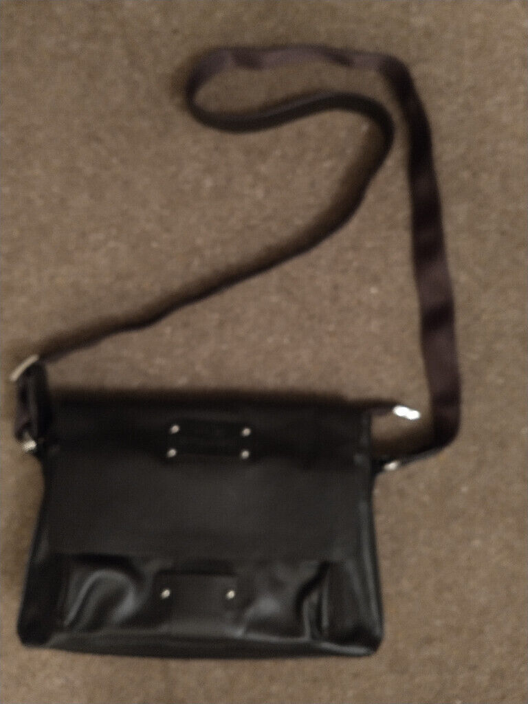 LEATHER SHOULDER BAG. Dark brown. 100 percent leather.New, unused in muslin bag.