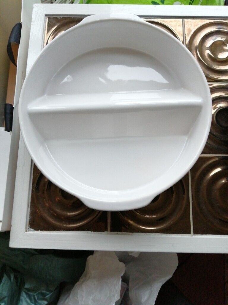 Two matching round oven dishes 