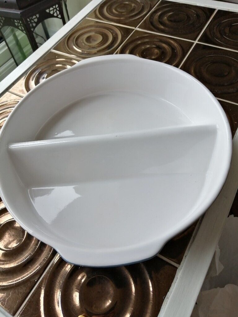 Two matching round oven dishes 