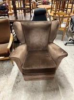 Elegant vintage brown wingback armchair