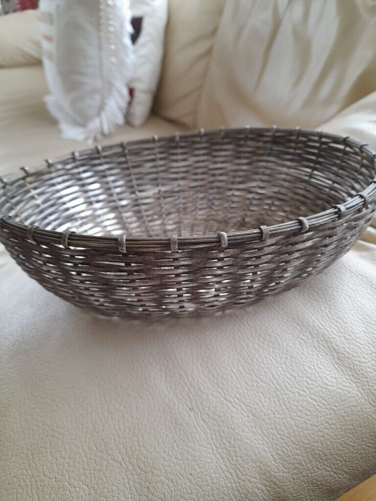 Vintage, silver metal woven bread or fruit basket. 