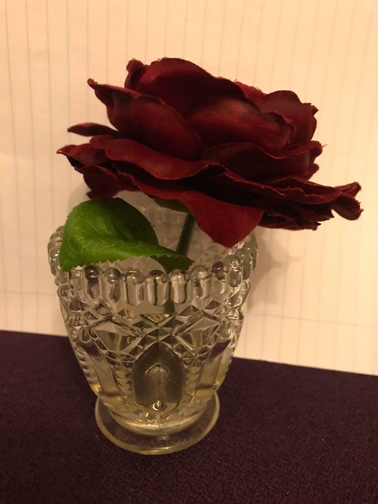 Small vase with red rose 