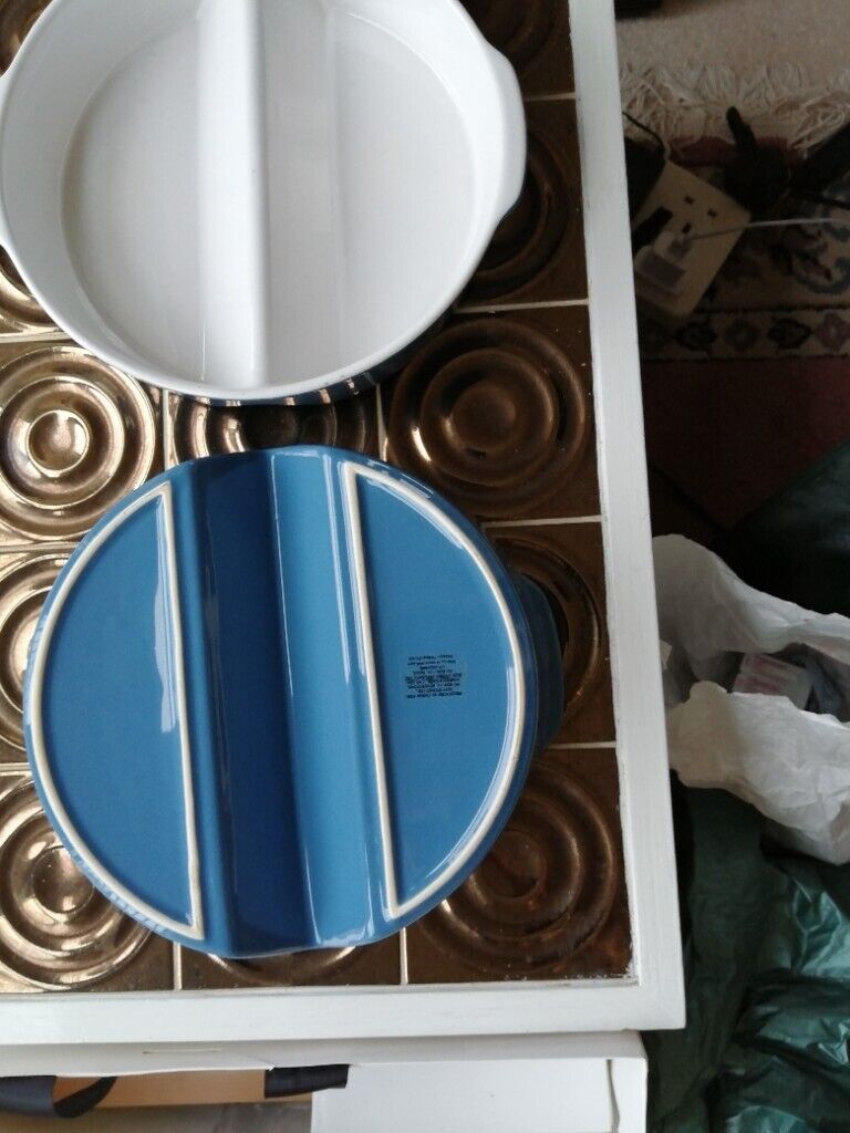 Two matching round oven dishes 