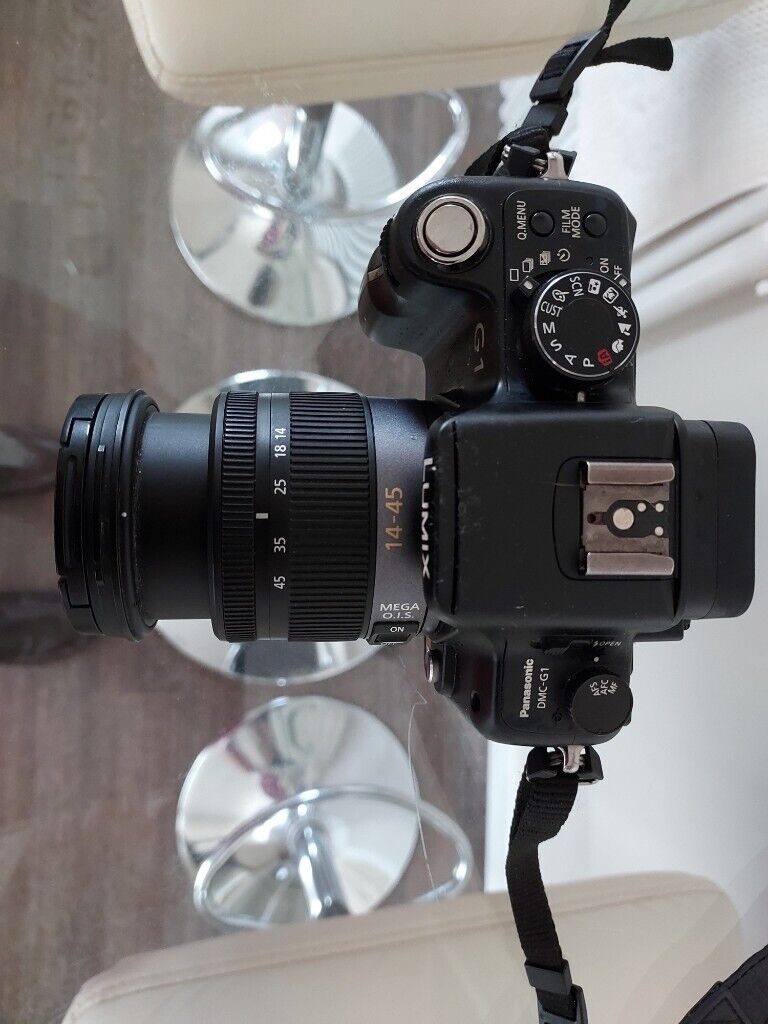 Panasonic Lumix DMC-G1 12.1MP Digital Camera with Lumix G Vario 14-45mm/F3.5-5.6 Lens and filters