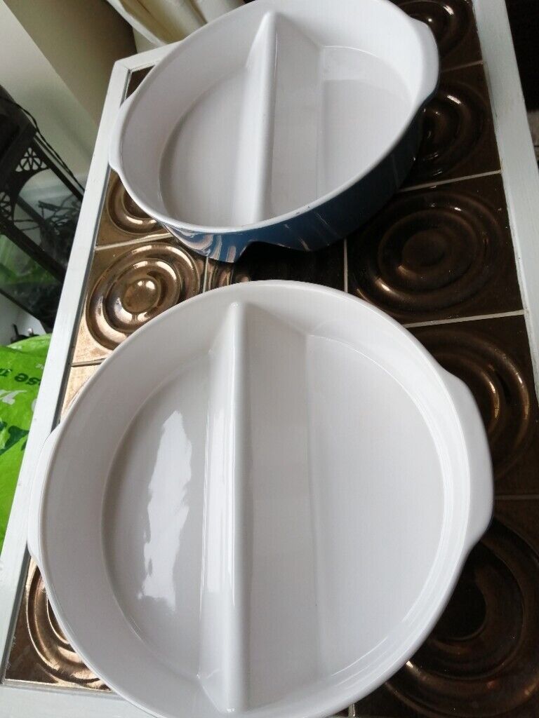 Two matching round oven dishes 