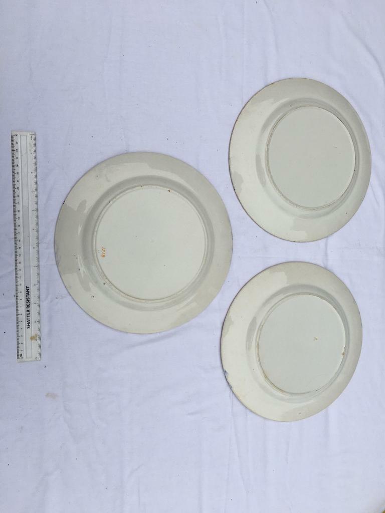 Three round dinner plates
