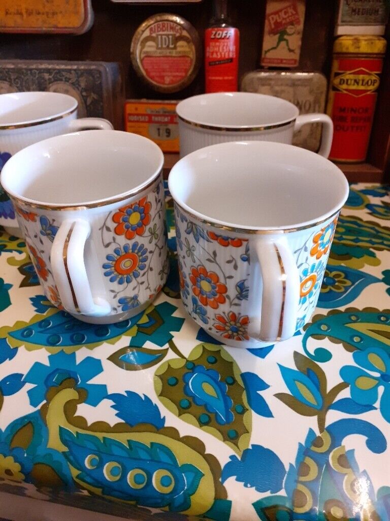 Unused retro mugs. Has gold coloured edging. Made in poland.