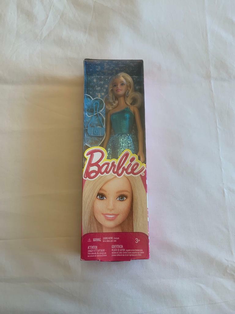 Rare Barbie BCN34 Blonde hair in a Blue Sparkly Dress & Blue Handbag. I think she is 2014.