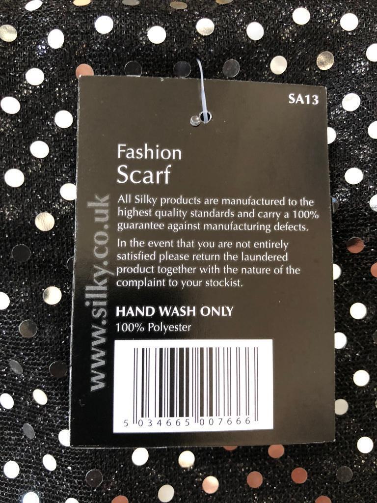 New scarf with tags in packet - Fashion scarf black and silver. Fringe