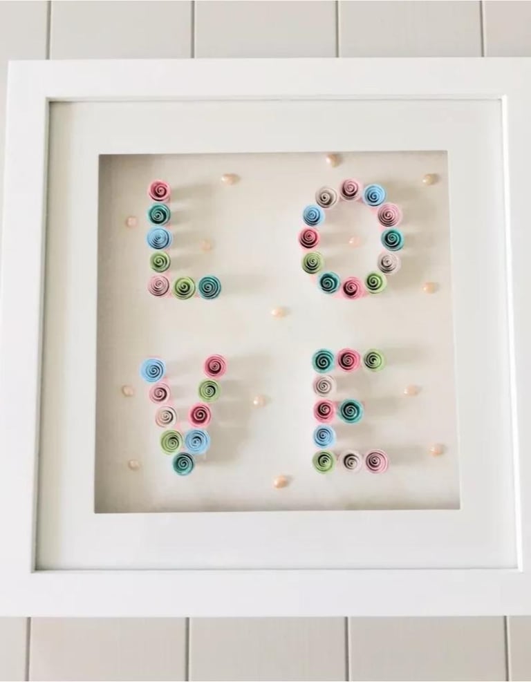 White framed picture with decorative paper and pearl love motif detail