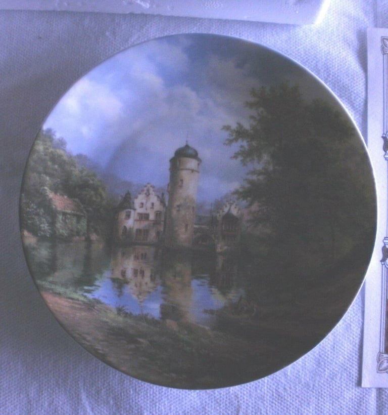 Moated castles by Eleonore  Guinther. Collectors Plates with the artist signature on the plate