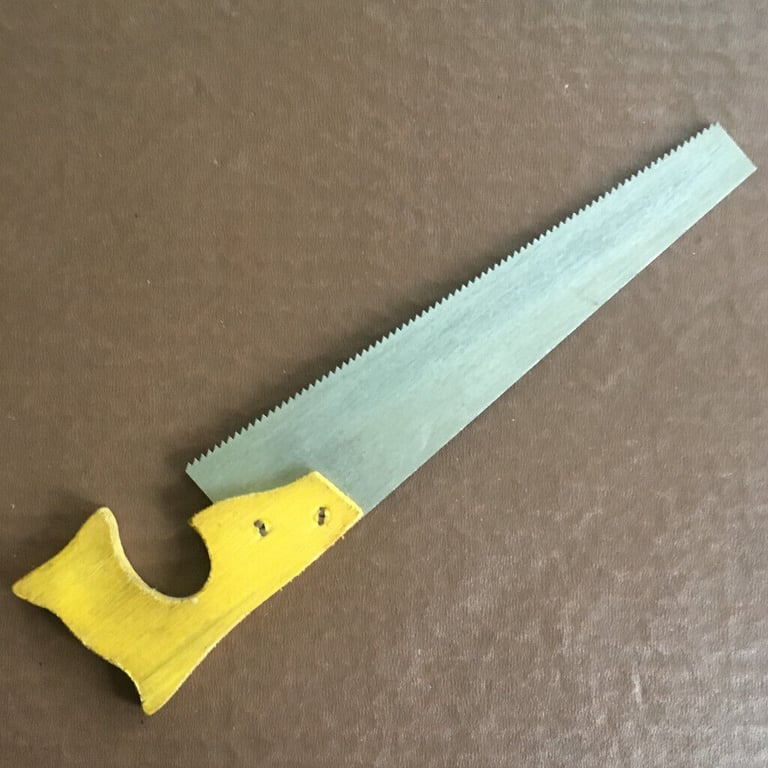 Vintage (1970's) toy saw. Wooden handle, aluminium blade. £4 ovno. Happy to post.
