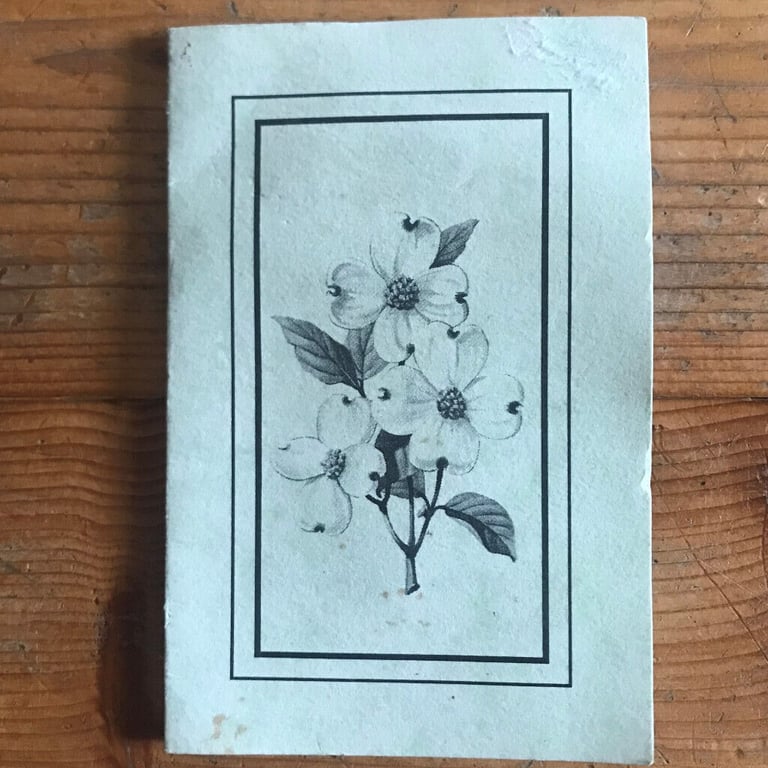 Unused goldtone metal bookmark, dogwood flower, in holder. From USA. £3 ovno. Can post.