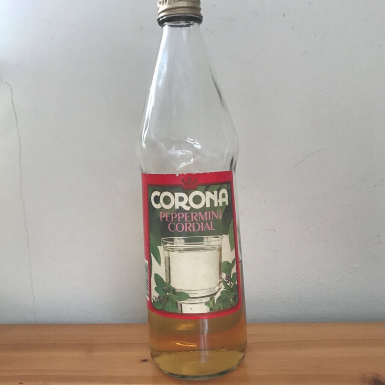 Vintage Corona Peppermint Cordial glass bottle + some contents.