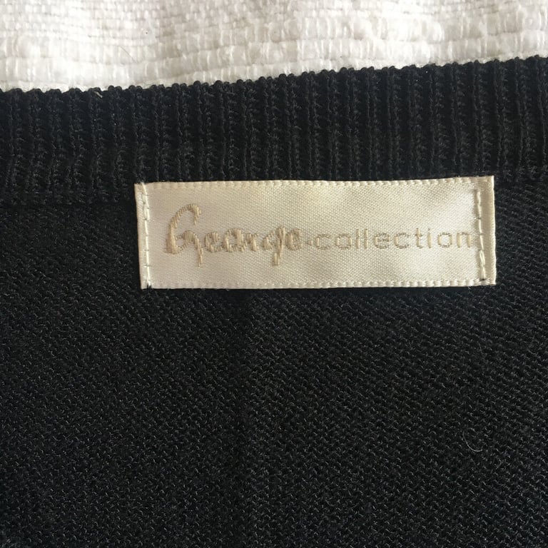 Women's black short sleeve cardigan, embroidered, bead embellished. 32-34 inch bust.