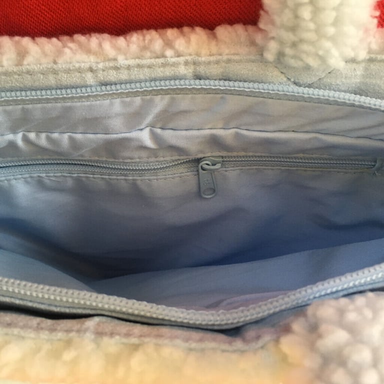  	Unused M&S pale blue suede and lambs wool effect bag. Happy to post. £4 ovno.